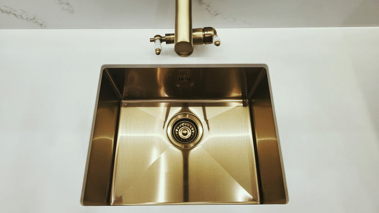 overhead view of a brass kitchen sink
