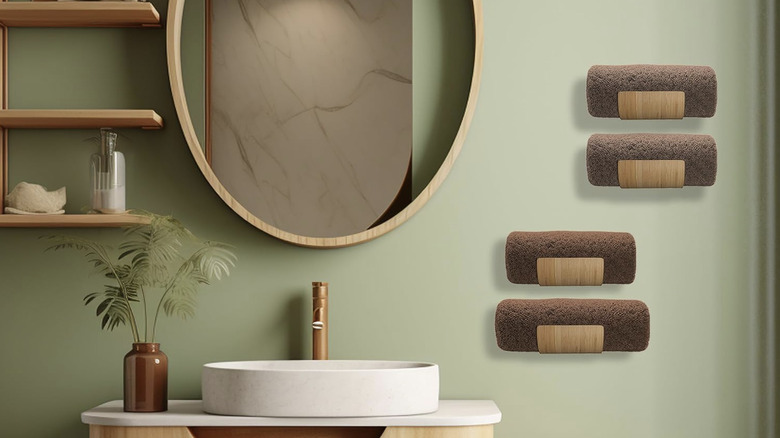 Four bamboo towel holders mounted by a modern bathroom sink