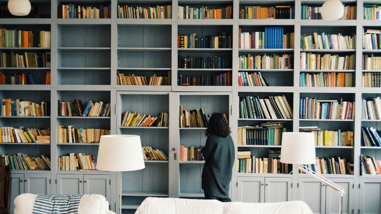 Woman looking at a bookshelf