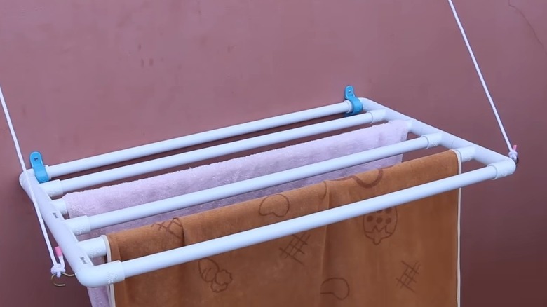 Swing down laundry rack