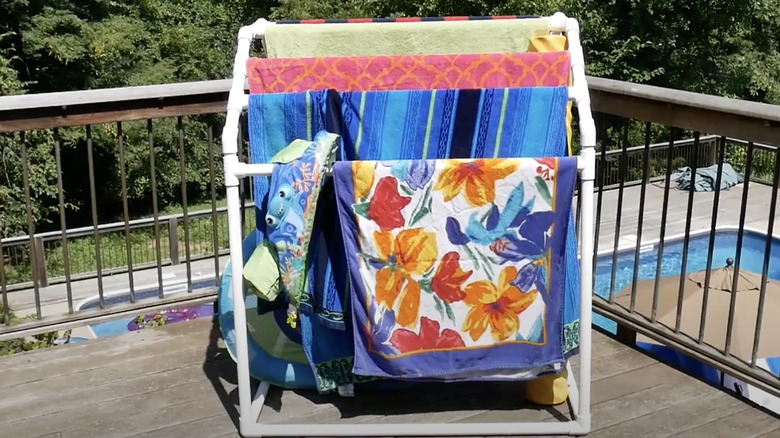 PVC pipe drying rack with towels on it