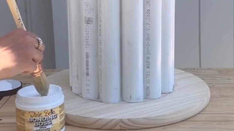video showing someone making a sidetable with PVC pipes