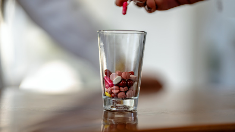 Pills in shot glass