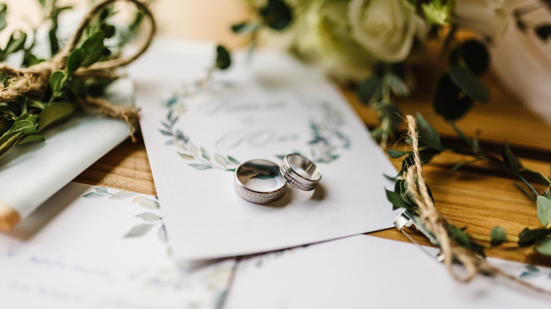 wedding detail shot with closeup on stationery and rings