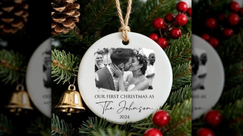 Christmas tree decoration with wedding photo hanging from tree