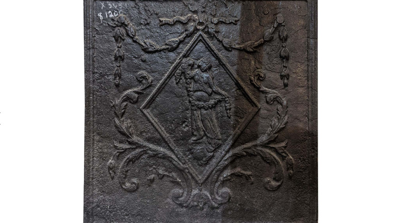 Venus on antique cast-iron fireback