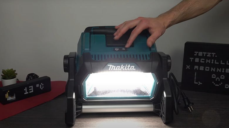 Makita work light on a wooden workbench