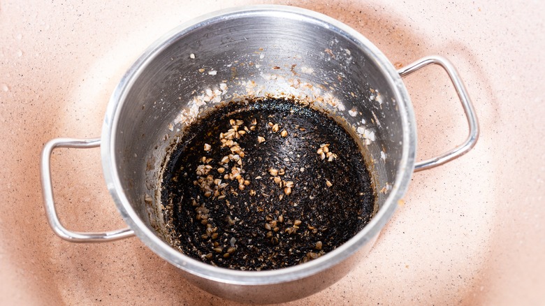 burnt food stuck inside pot