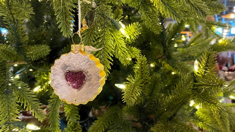 sparkling cookie ornament on tree