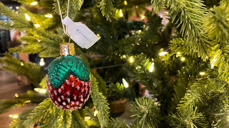 sparkling strawberry ornament on tree