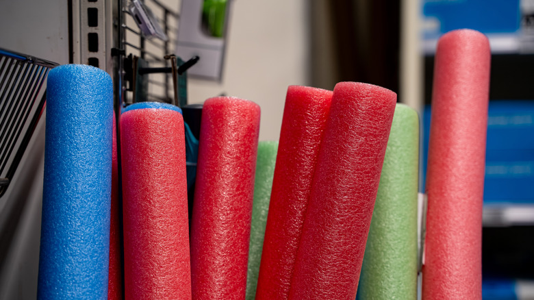 Pool noodles standing in an equipment room