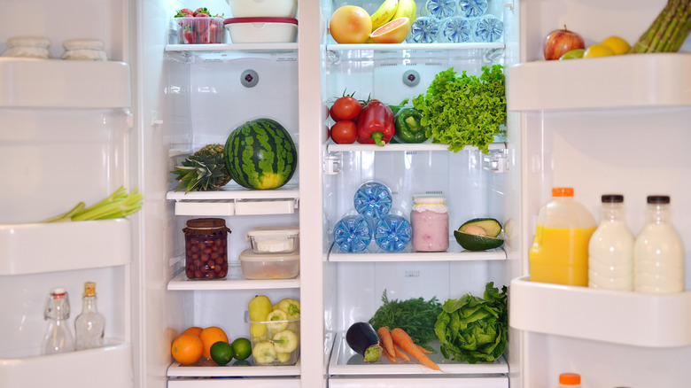 Organized refrigerator filled with produce.