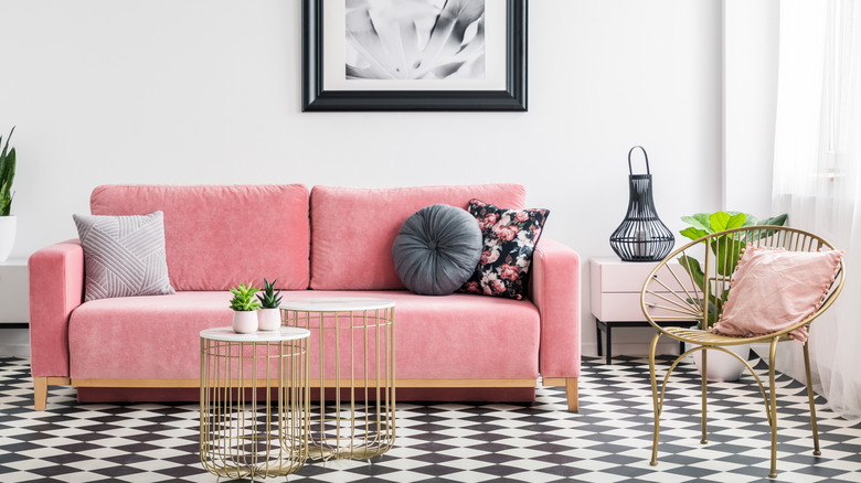 A vibrant living room with velvet and printed details