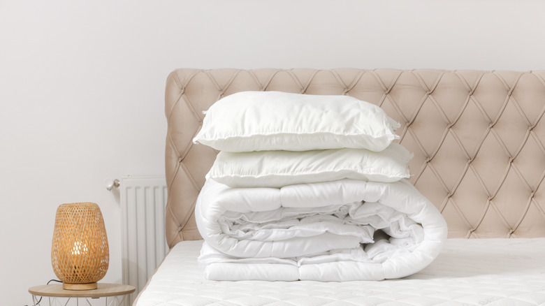 Close up of folded duvet on bed