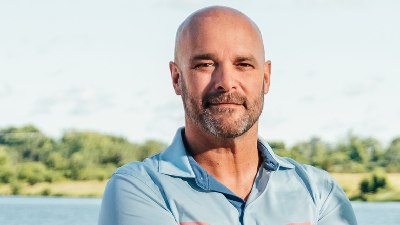Bryan Beaumler standing by a lake
