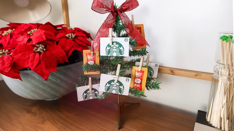 A Christmas tree holding multiple gift cards