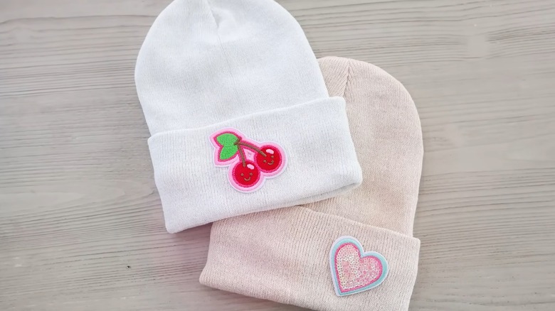 White and beige hats with pretty decals on them