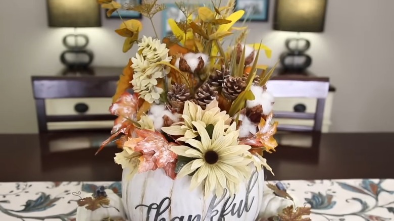 Fall-inspired flowers inside a white foam pumpkin