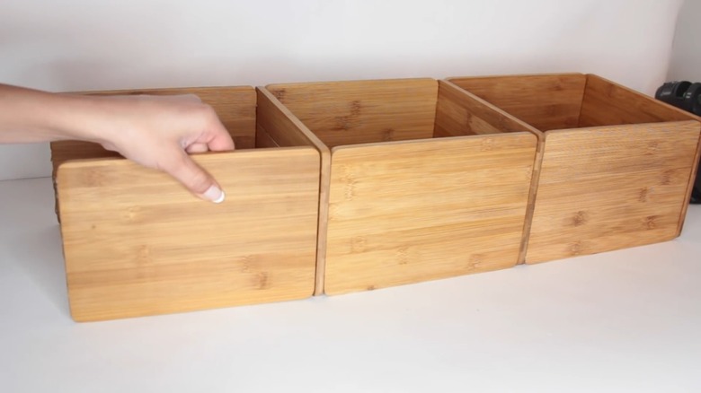 Hand gluing cutting boards to make a storage cube