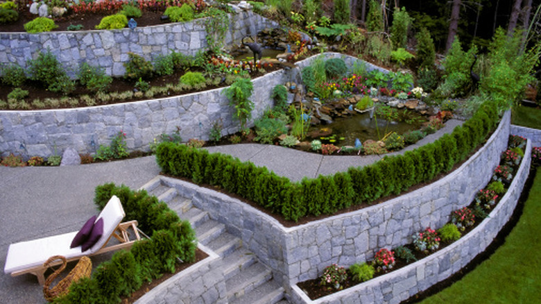 beautiful landscaping with multiple levels of retaining walls