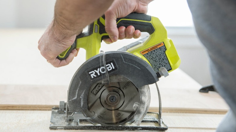 A close up shot of a Ryobi saw in use