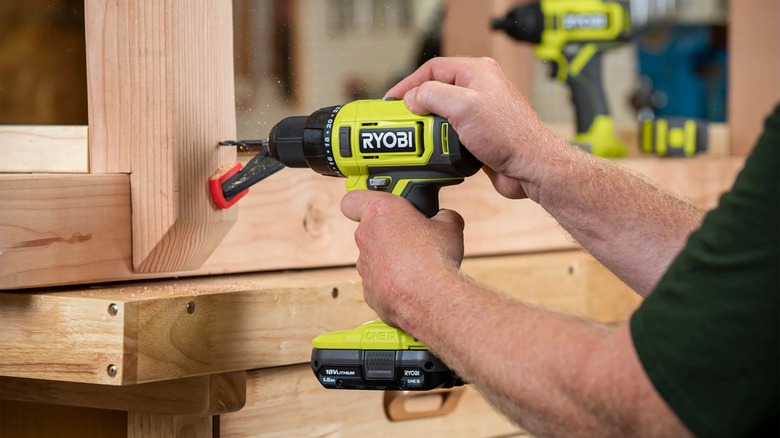 A close up shot of a Ryobi drill in use
