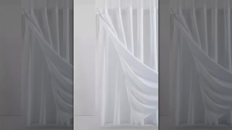 The White Textured Waffle Shower Curtain with Detachable Liner by Dainty Home at Home Depot.