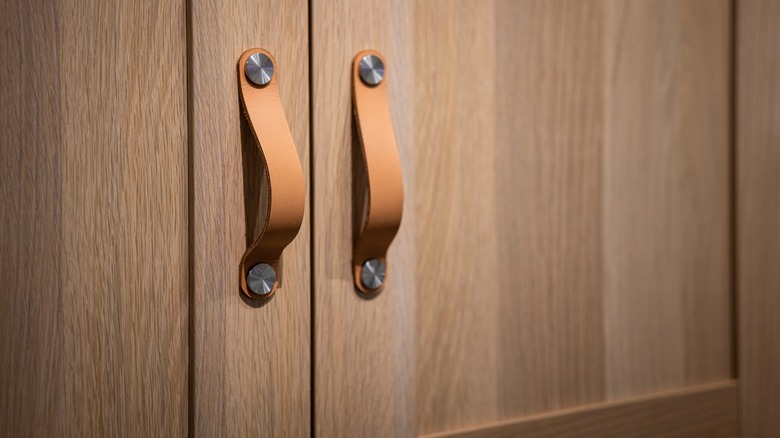 Leather pulls on a cabinet