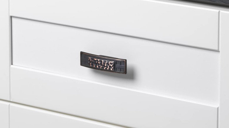 A hammered oil-rubbed bronze drawer pull.