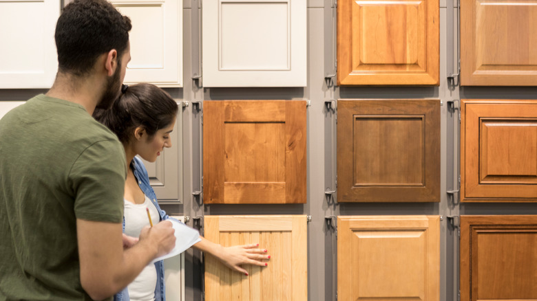 couple looking at cabinet samples