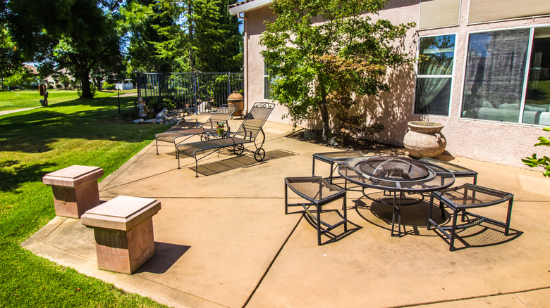 Concrete patio in the backyard of a home