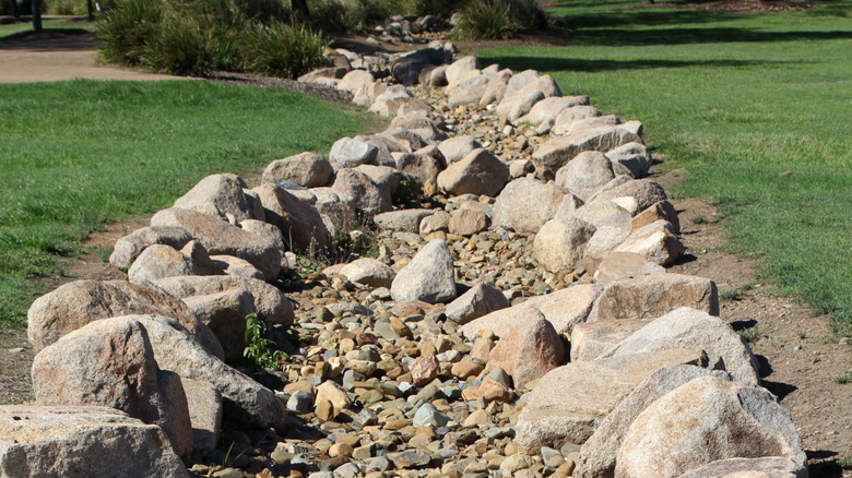 A dry creek bed ready to direct floodwater