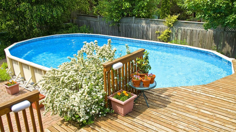 Deck surrounds above-ground pool