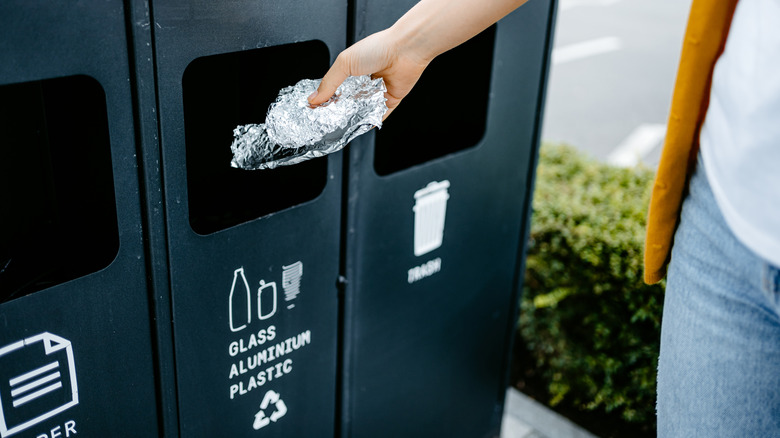woman recycling aluminium foil 