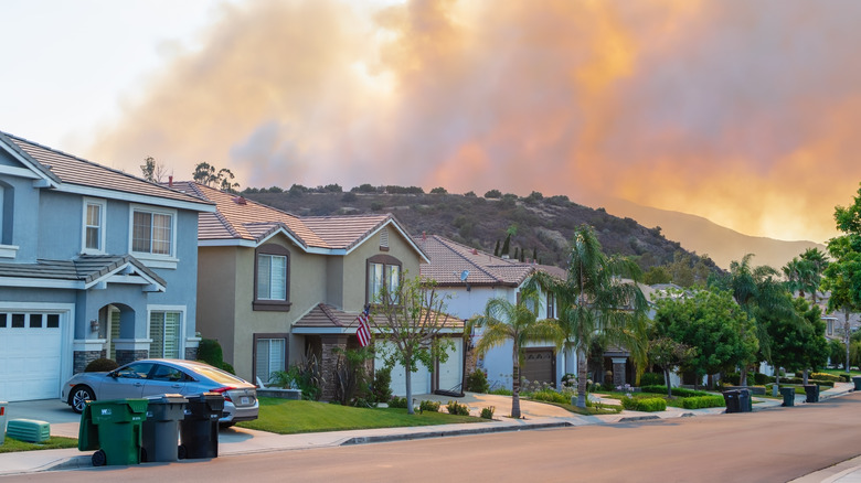 Homes with wildfire in distance