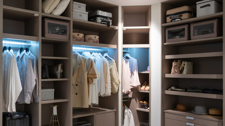 Clothing, accessories, and more organized in a luxurious custom closet