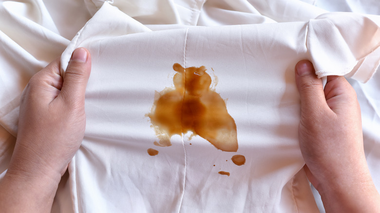 White shirt with brown stain
