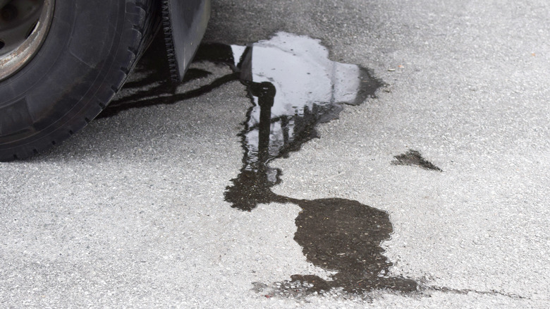 car spilling oil on concrete