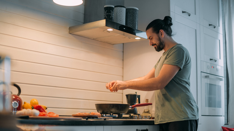 Man cooking on stove