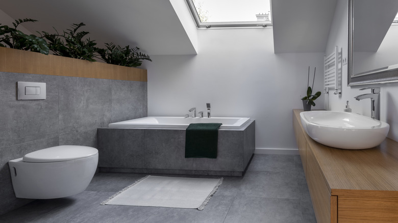 Contemporary bathroom design with a wall-mounted toilet