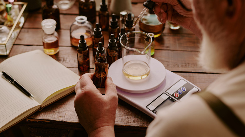 Person combining essential oils