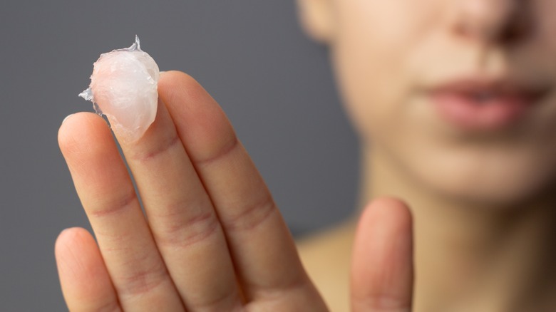woman holding some vicks