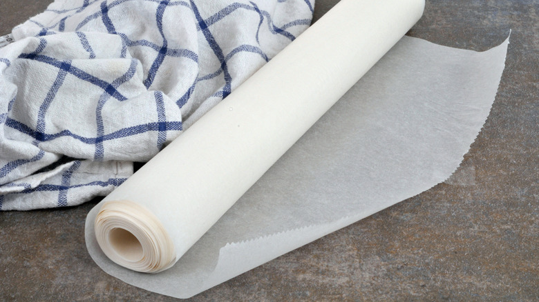 A roll of wax paper on a countertop.