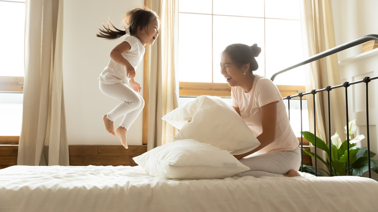 Kid jumping on the bed