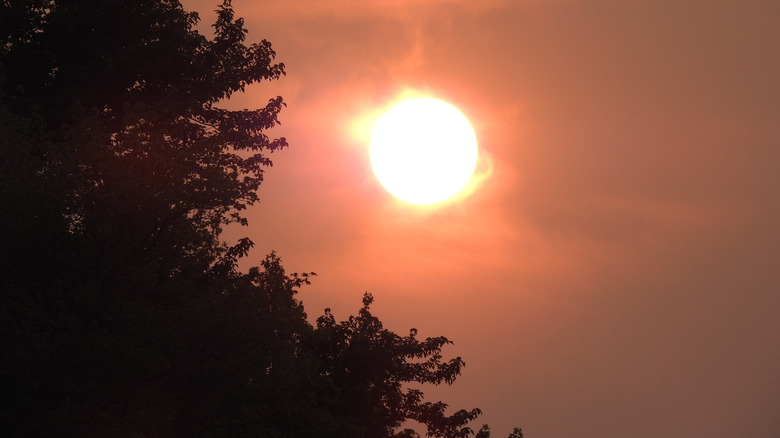 Sun setting in Delaware in smoky sky