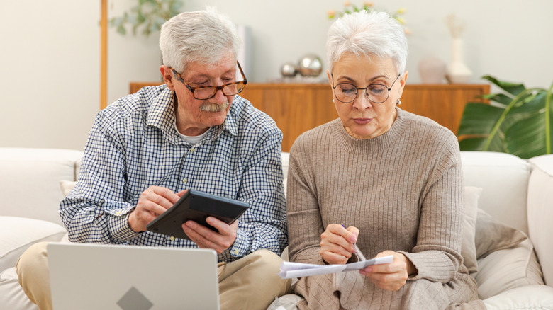 Old couple working on finances