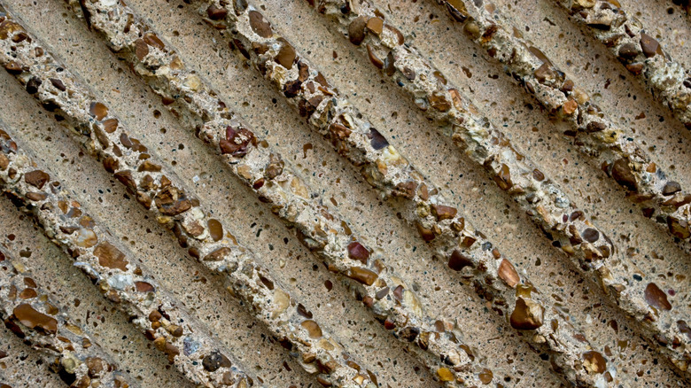 A closeup of concrete and pebble mixture
