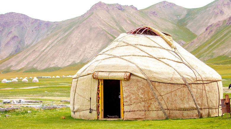 Yurt with mountains in background