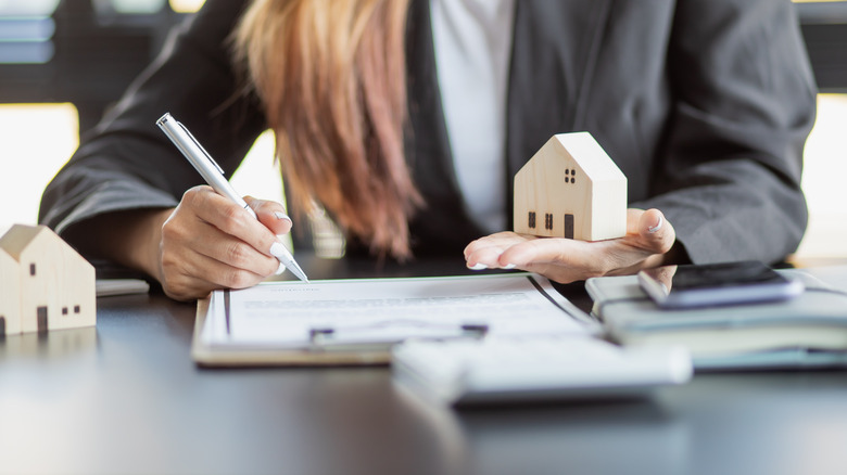 Woman finalizing new mortgage