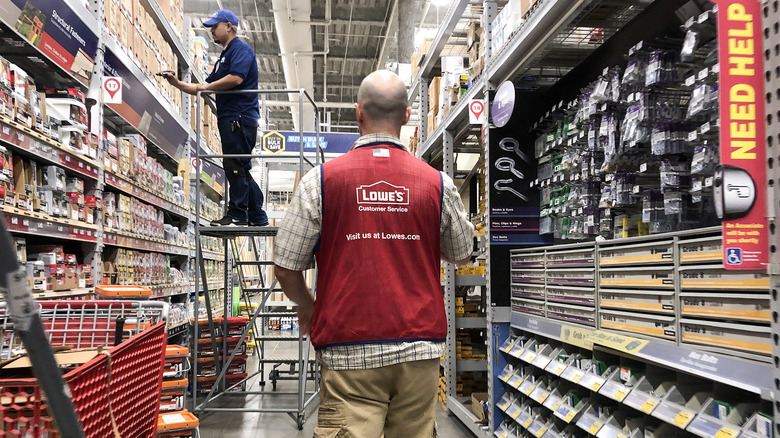 Lowe's employees in an aisle